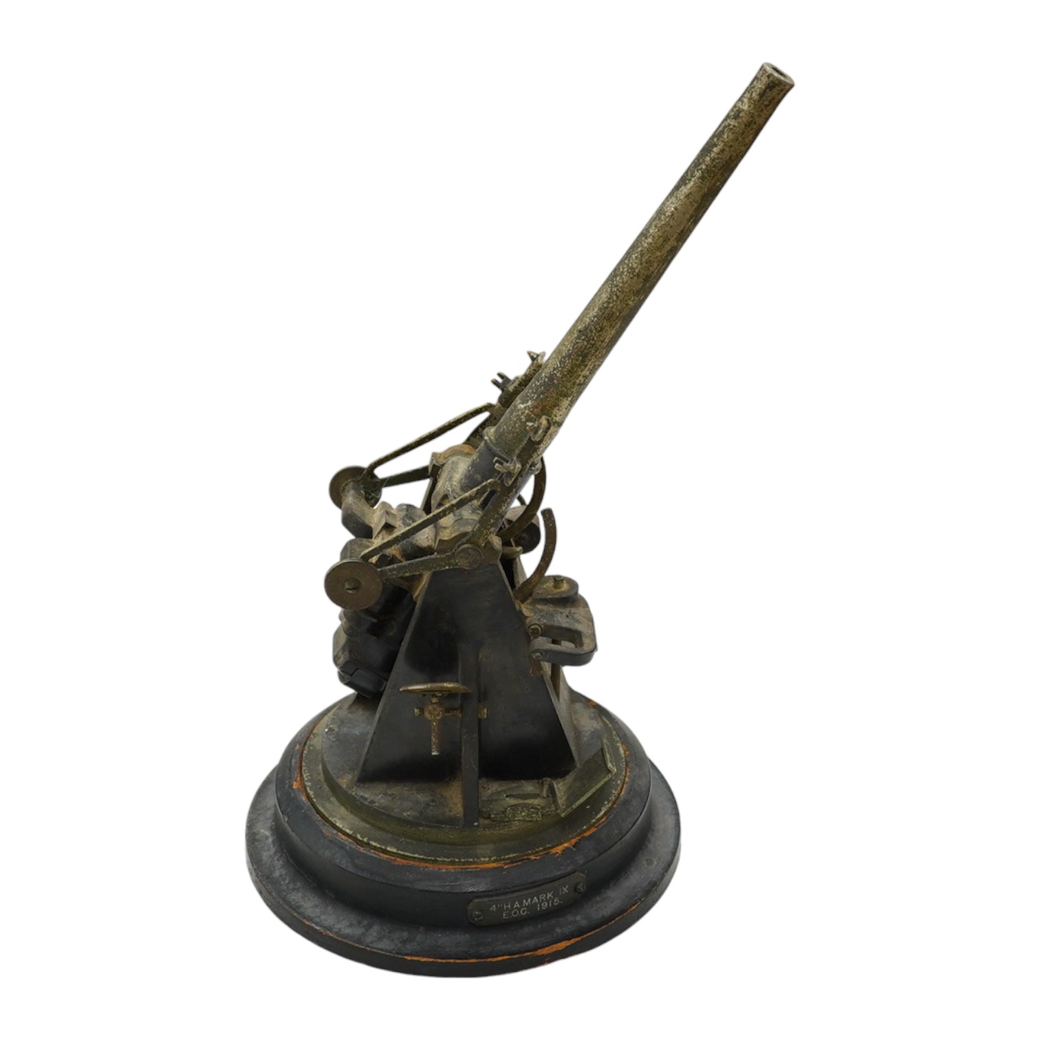 A steel model of a First World War 4 inch mark IX E.O.C. anti-aircraft gun, barrel 18cm, on a turned ebonised pine base with applied label. Condition - fair, some wear overall.